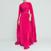 Pink evening gown with cape on a gray background, featuring the brand 'TWOTWINSTYLE'.