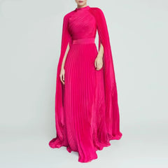 Pink evening gown with cape on a gray background, featuring the brand 'TWOTWINSTYLE'.