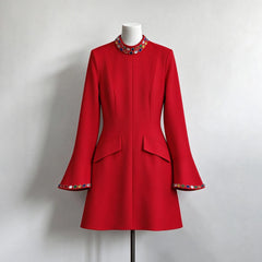 Red crystal embellished stand neck mini dress on mannequin