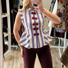 Striped peplum top with knot buttons and sleeveless design
