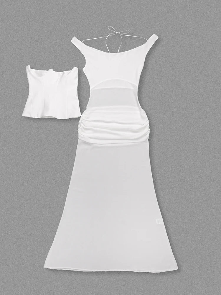 White evening gown and matching blouse on a gray background