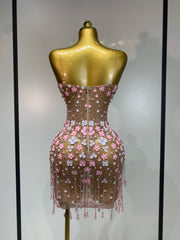 Appliqued flower mini dress, back view.