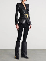 Person wearing a black leather outfit with high boots