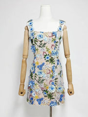 Floral dress on a mannequin against a white background
