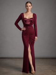 Burgundy draped collar ruched gown dress with long sleeves and a high slit.