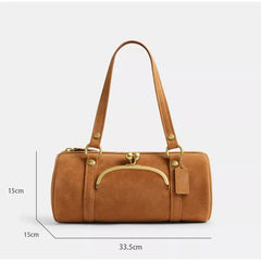 Brown handbag with gold accents and dimensions on a white background