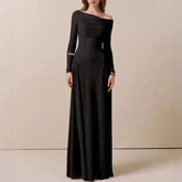 Black one-shoulder evening gown on a neutral background