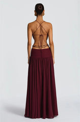 Burgundy dress with a backless design on a white background