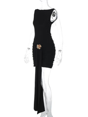 Black dress with floral embellishment on a mannequin against a white background
