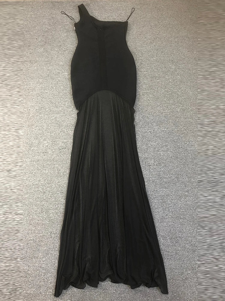 Black evening gown on a textured gray surface