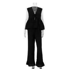 Black peplum top and flared pants set on a mannequin