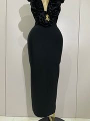 Black dress on a mannequin against a plain background