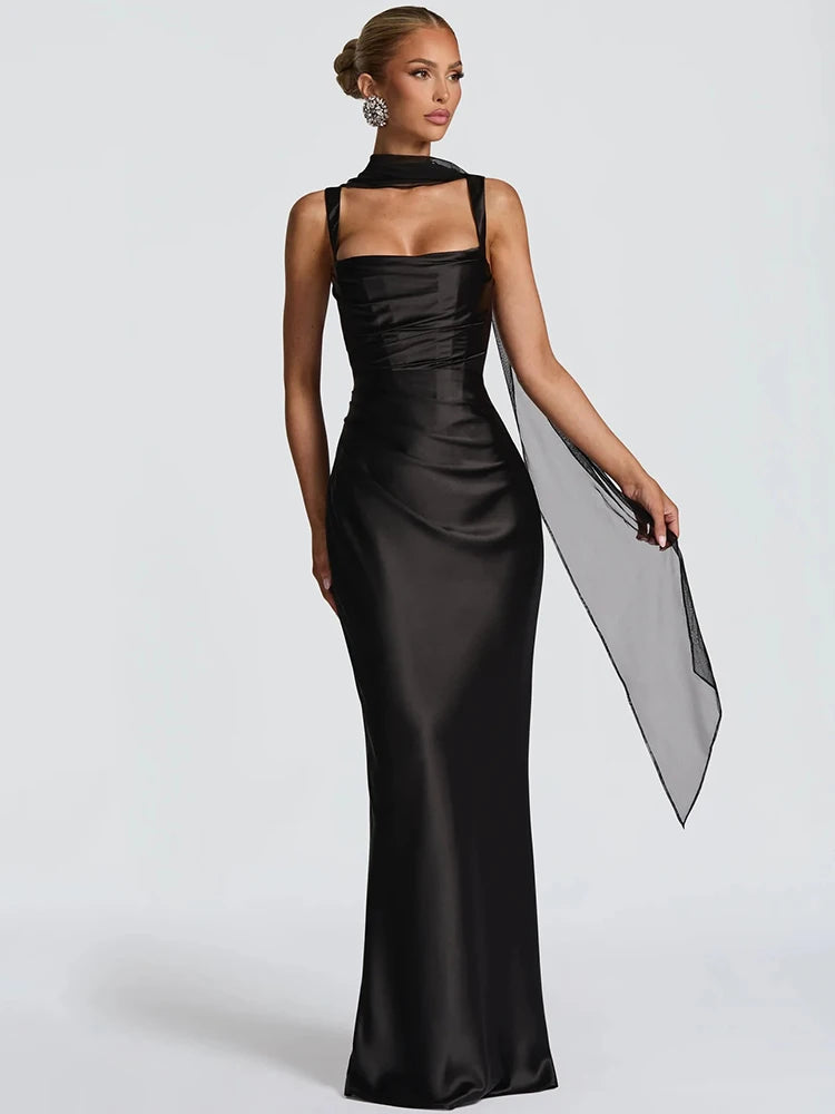 Woman wearing a black evening gown on a white background