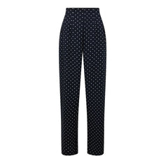 Black pants with white polka dot pattern on a white background