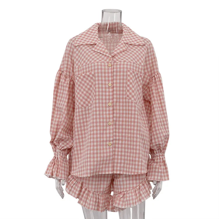 Pink gingham pajama set on a mannequin against a white background