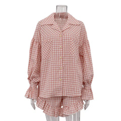 Pink gingham pajama set on a mannequin against a white background