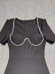 Elegant Black Midi Dress with Pearl Neckline & Feather Hem