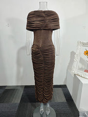 Brown ruched dress on a mannequin against a white wall.