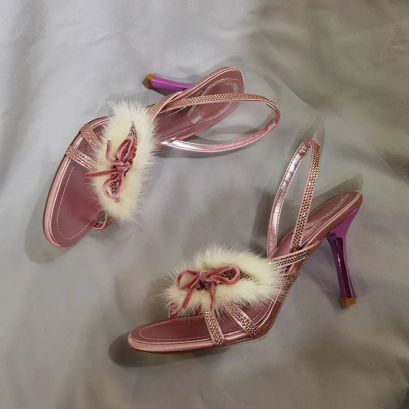 Pink stiletto heel with faux fur bow and rhinestone straps