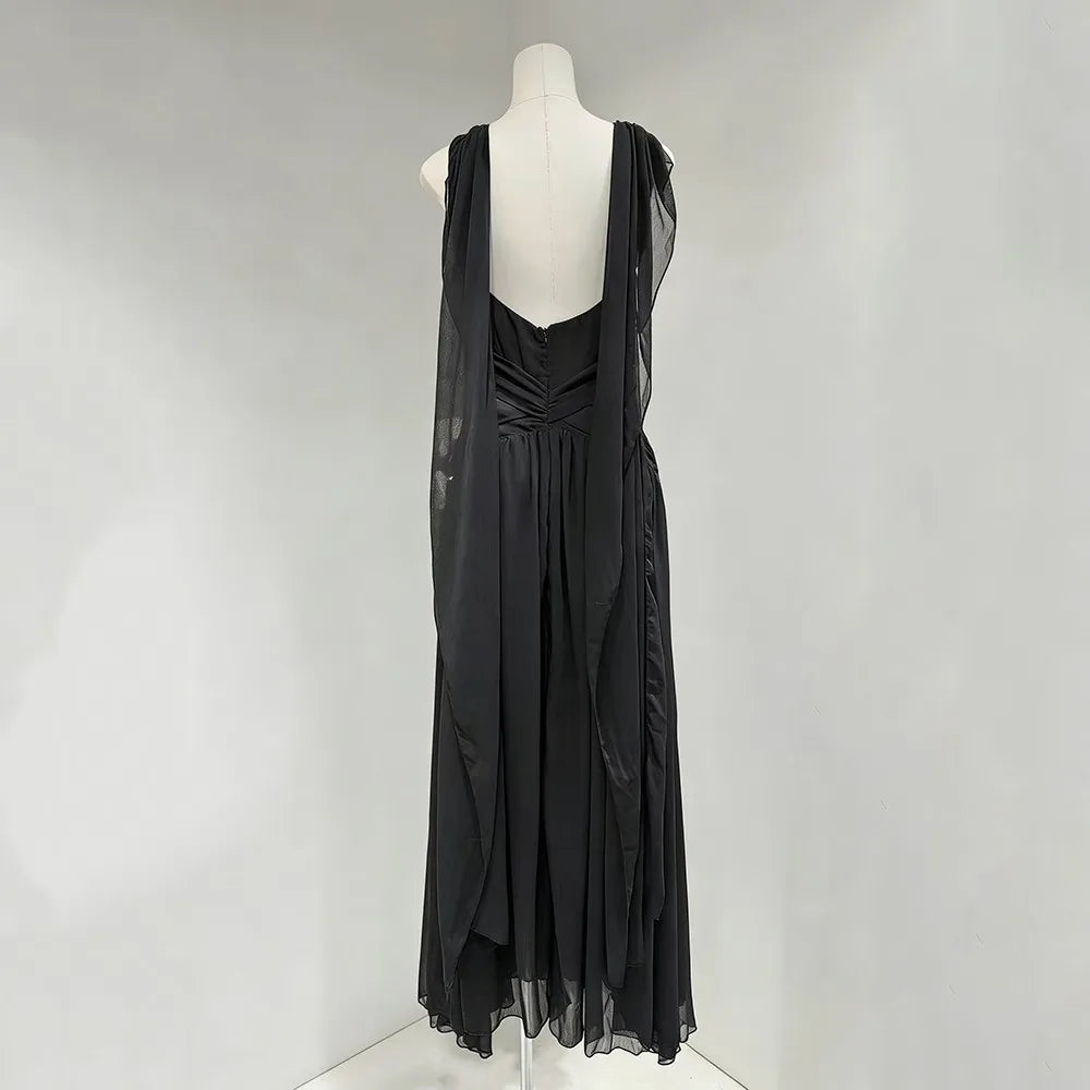 Black dress on a mannequin against a white background