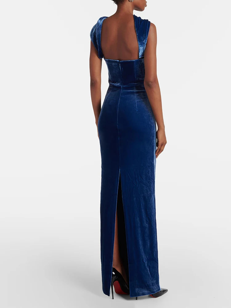 Blue evening gown with a high slit on a white background