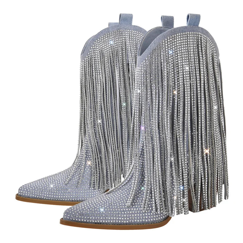 Pair of silver fringed boots with rhinestone embellishments on a white background
