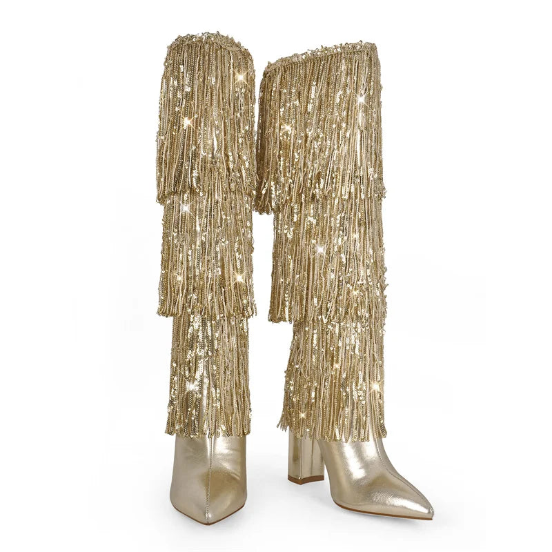 Front view of gold pointed toe knee high boots with layered fringe