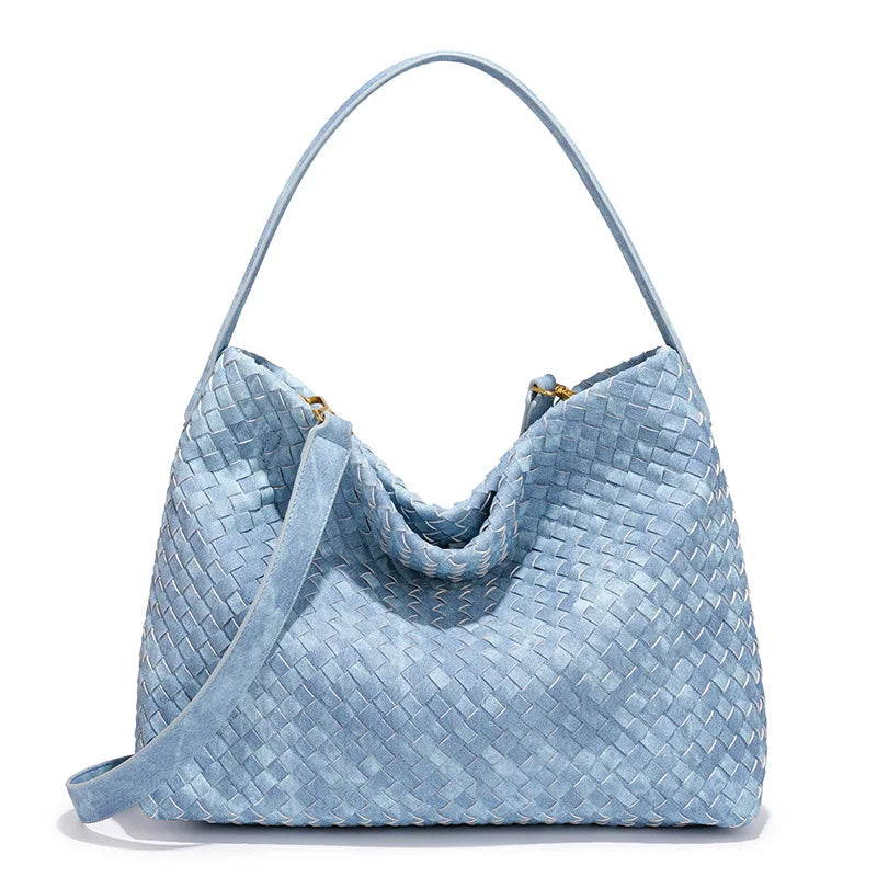 Light blue woven handbag on a white background