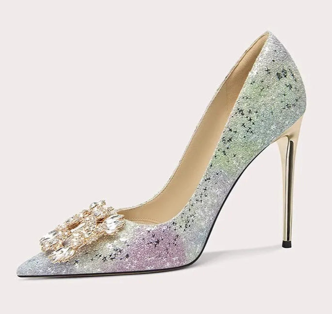 High-heeled shoe with glittery design and decorative element on a white background