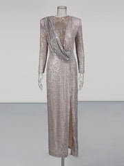 Silver sequin evening gown on a mannequin against a plain background