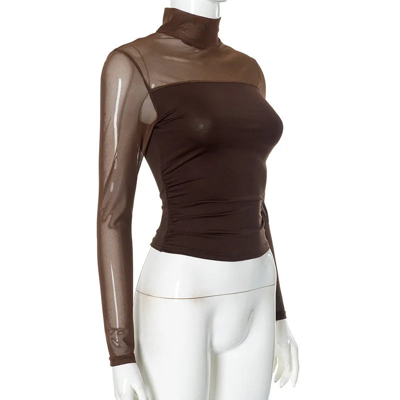 Brown turtleneck top with sheer sleeves on a mannequin against a white background