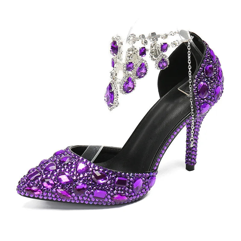 Purple stiletto shoe with rhinestone embellishments on a white background