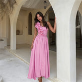 One shoulder swimsuit set with ruffle trim and flowing maxi skirt.