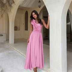 One shoulder swimsuit set with ruffle trim and flowing maxi skirt.