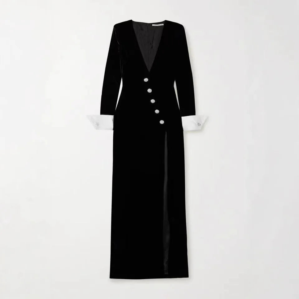 Black dress with buttons on a white background