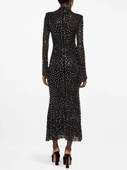 Crystal embellished turtleneck midi dress on a model, back view.