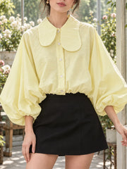 Lapel collar lantern sleeve blouse in yellow, close-up