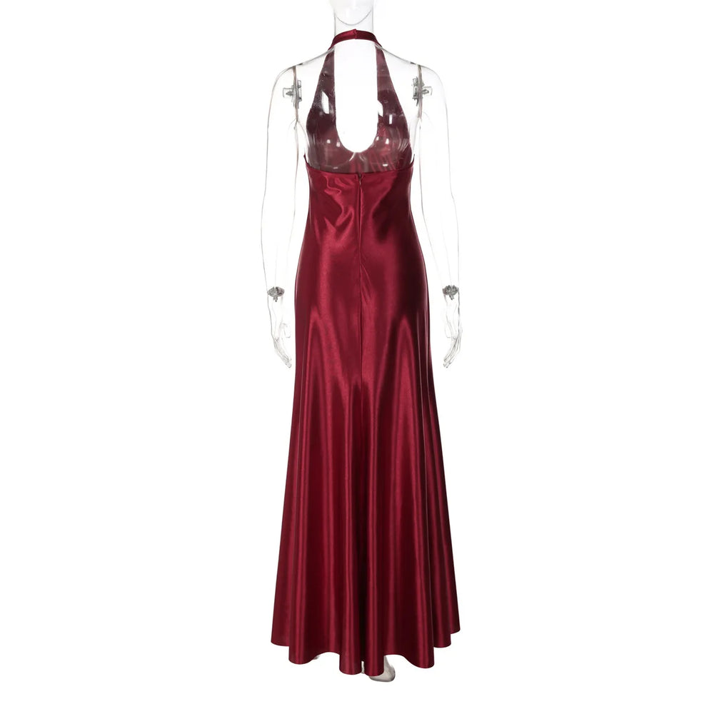 Red satin evening gown on a mannequin against a white background