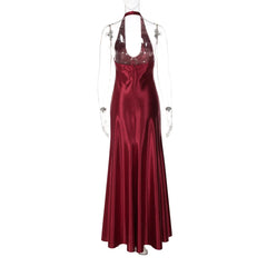 Red satin evening gown on a mannequin against a white background