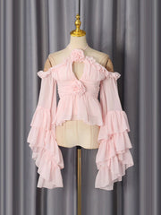 Pink two-piece top with ruffled sleeves and floral detail on a mannequin