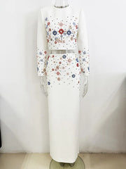 White embellished cropped top and maxi skirt on a mannequin