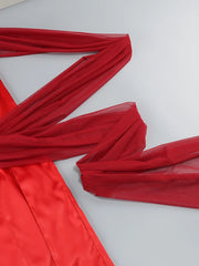 Red fabric with a sheer overlay on a white background