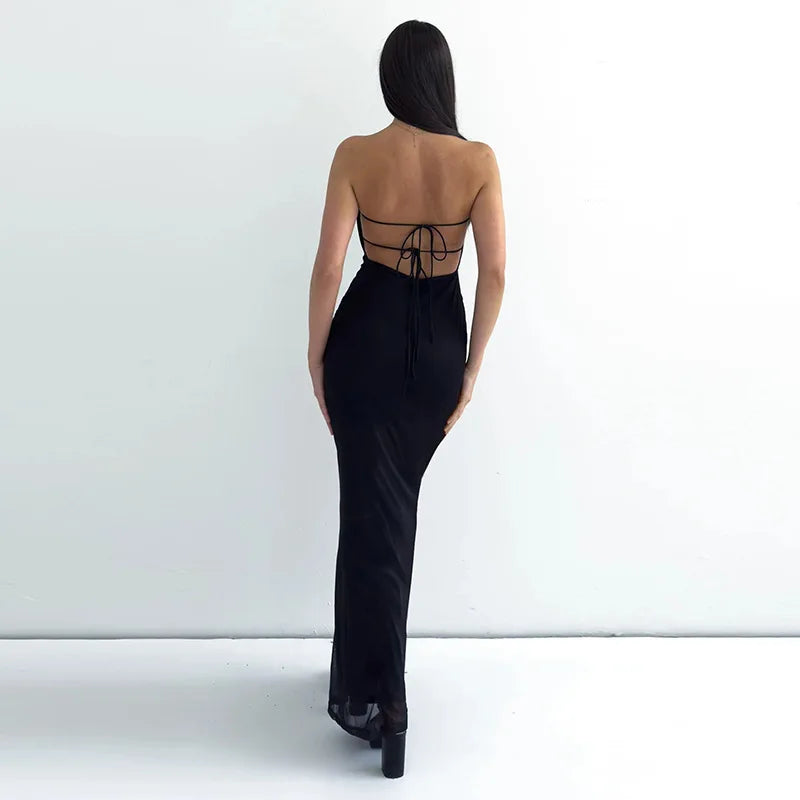 Woman wearing a black strapless gown with an open back