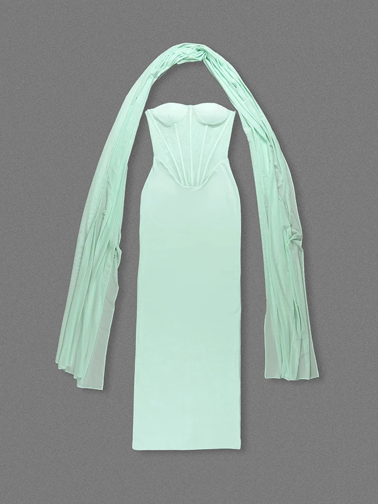 Mint green strapless dress with sheer sleeves on a gray background