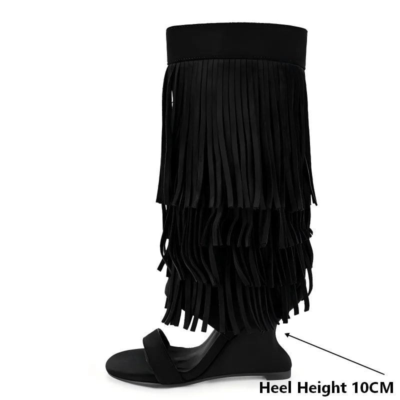 Heel height detail on black fringe wedge heel boots