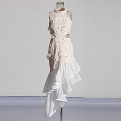 White floral dress on a mannequin against a plain background