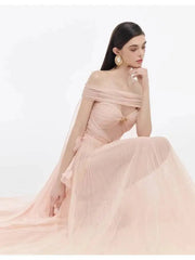Close-up of a model in an off-the-shoulder mesh evening gown