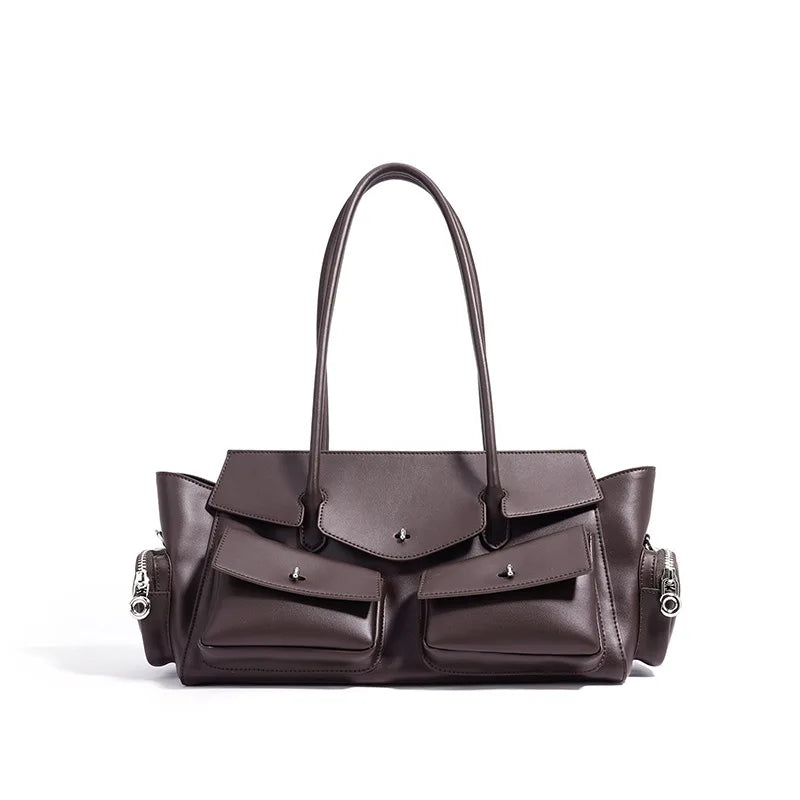 Brown leather handbag with multiple pockets on a white background