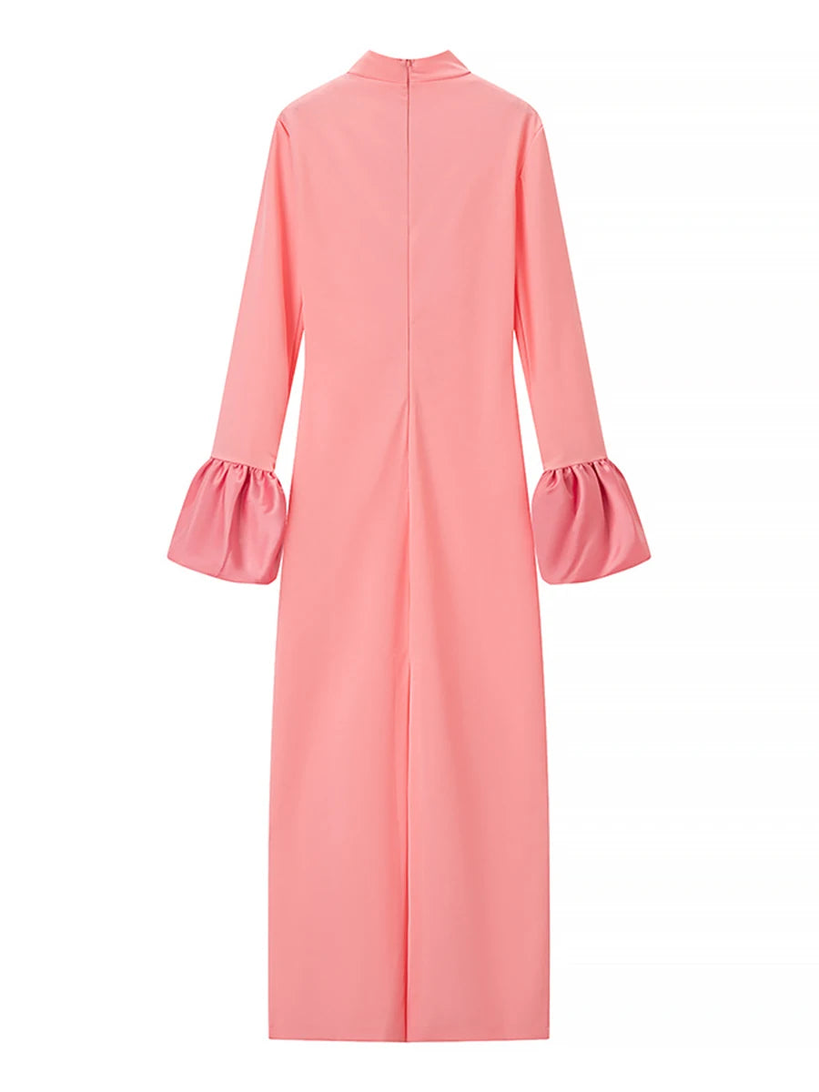 Pink dress with ruffled sleeves on a white background