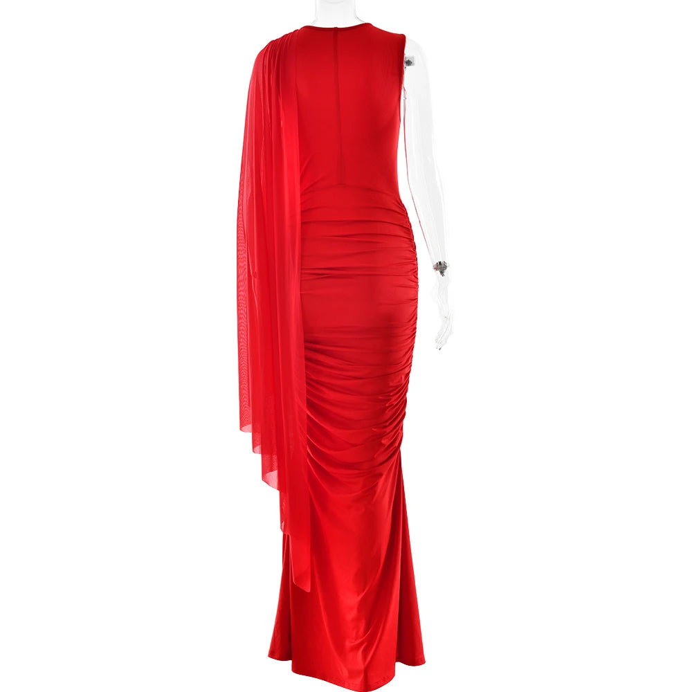 Red evening gown on a mannequin against a white background
